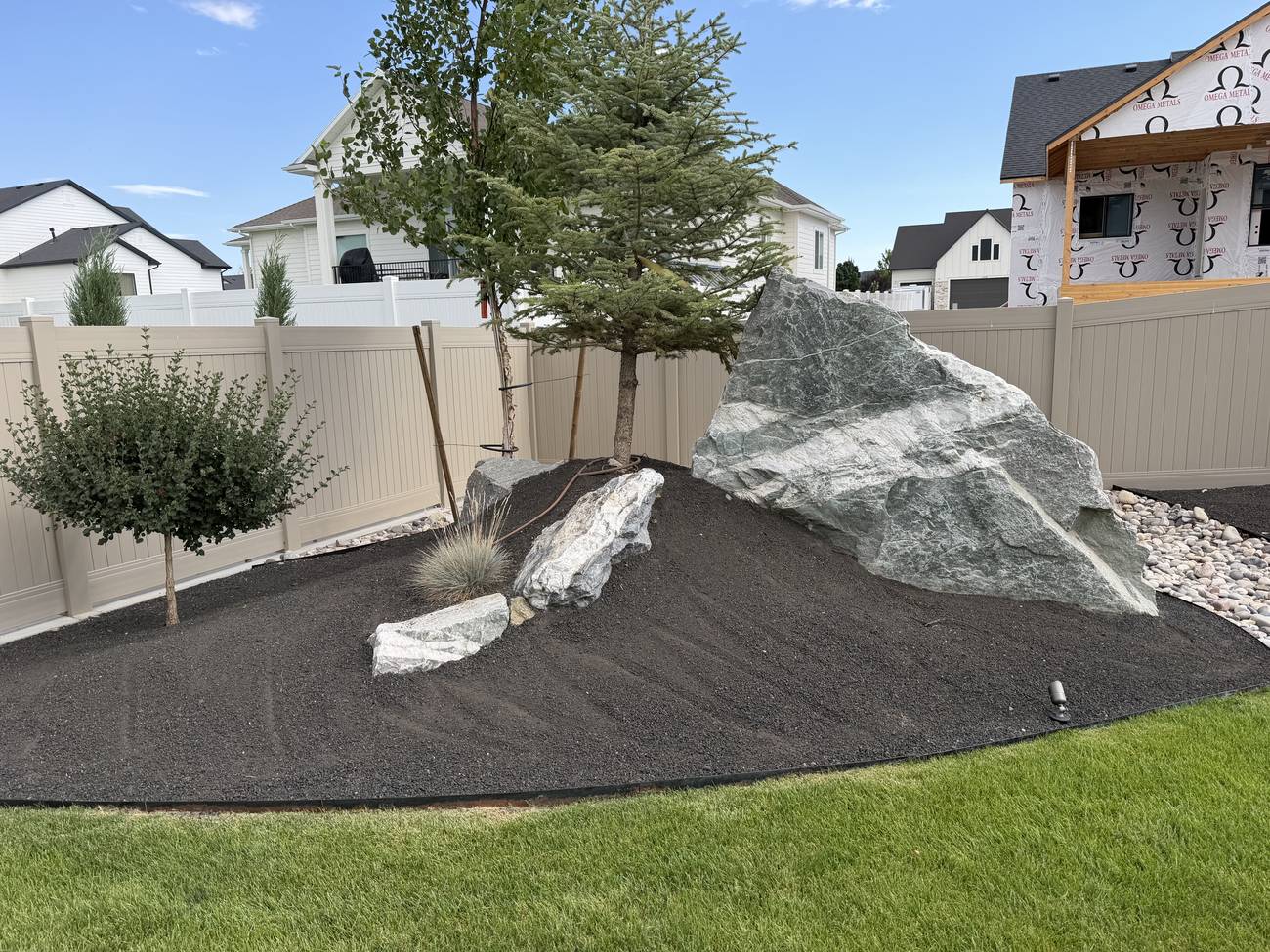 Feature boulder set in a finished landscape