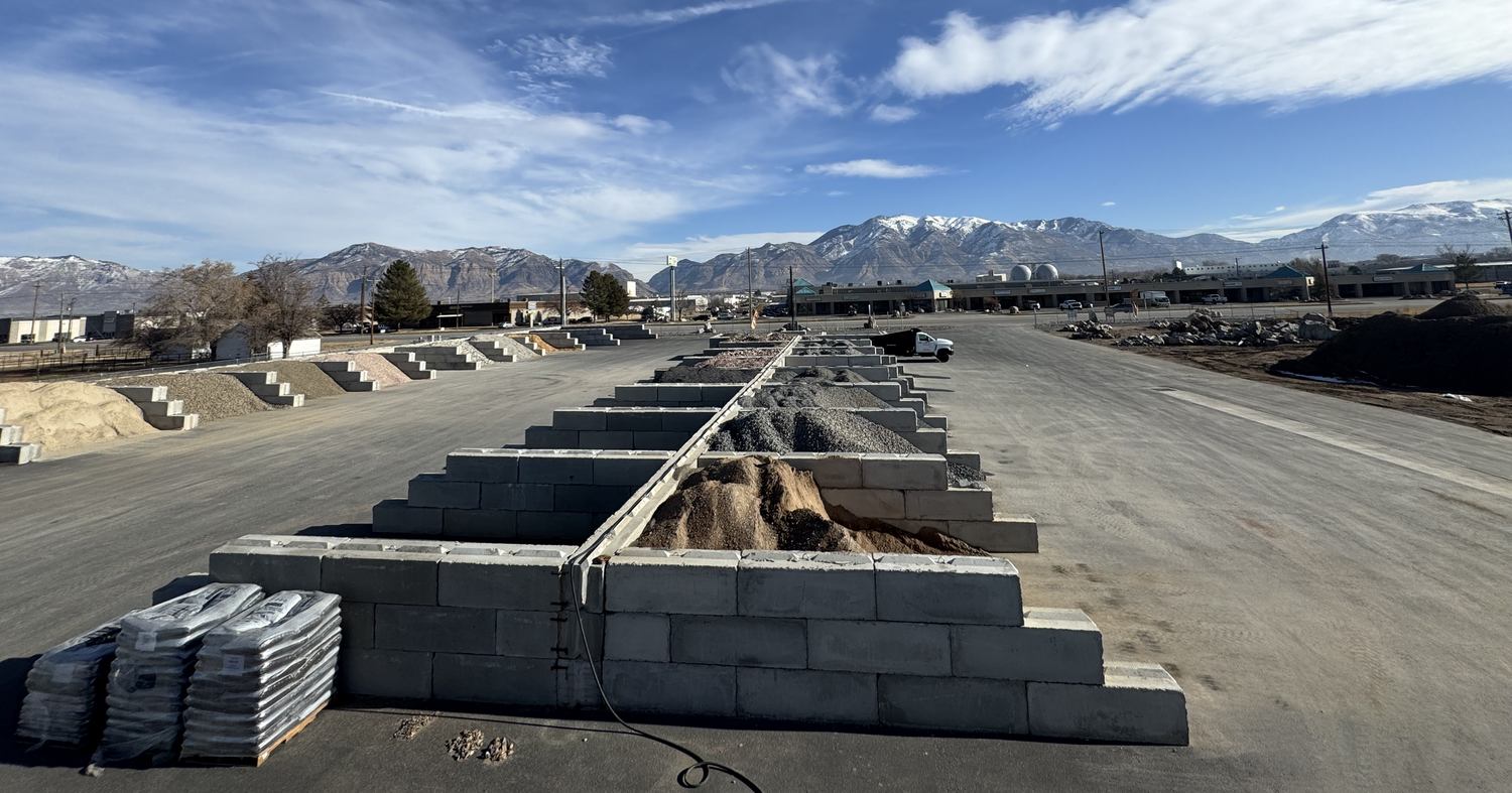 Concrete display bins at Greystone holding separated decorative rock and aggregate products
